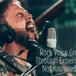 A rock singer performing with powerful voice — Rock Voice Grows Through Experience, Not Knowledge.